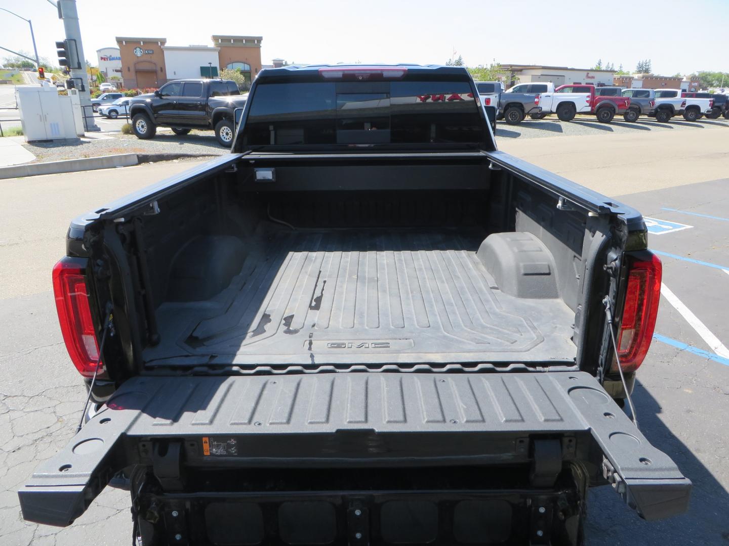 2020 BLACK /BLACK GMC Sierra 2500HD AT4 (1GT49PE76LF) with an 6.6L V8 engine, automatic transmission, located at 2630 Grass Valley Highway, Auburn, CA, 95603, (530) 508-5100, 38.937893, -121.095482 - Features a 3" BDS level kit with Fox shocks, 35" Toyo RT trail tires, 17" Method race wheels, JL audio Subwoofer, Window tint, and a power Tonneau cover. - Photo#13